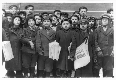 Group of newsboys at the Times Office, Hartford, Conn. The newsgirls mingle and jostle these boys in the office and in the yard. Location: Hartford, Connecticut.