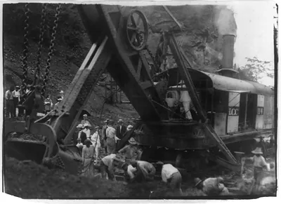 [Pres. Theodore Roosevelt on steam-powered digging machine during construction of the Panama Canal]