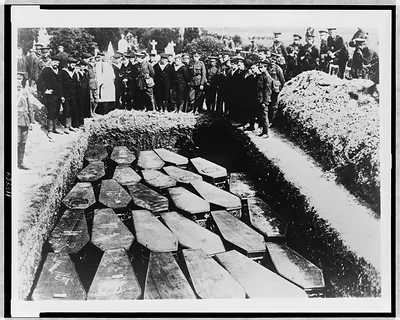 Victims of Lusitania sinking, after recovery from sea, are buried in Ireland in common grave