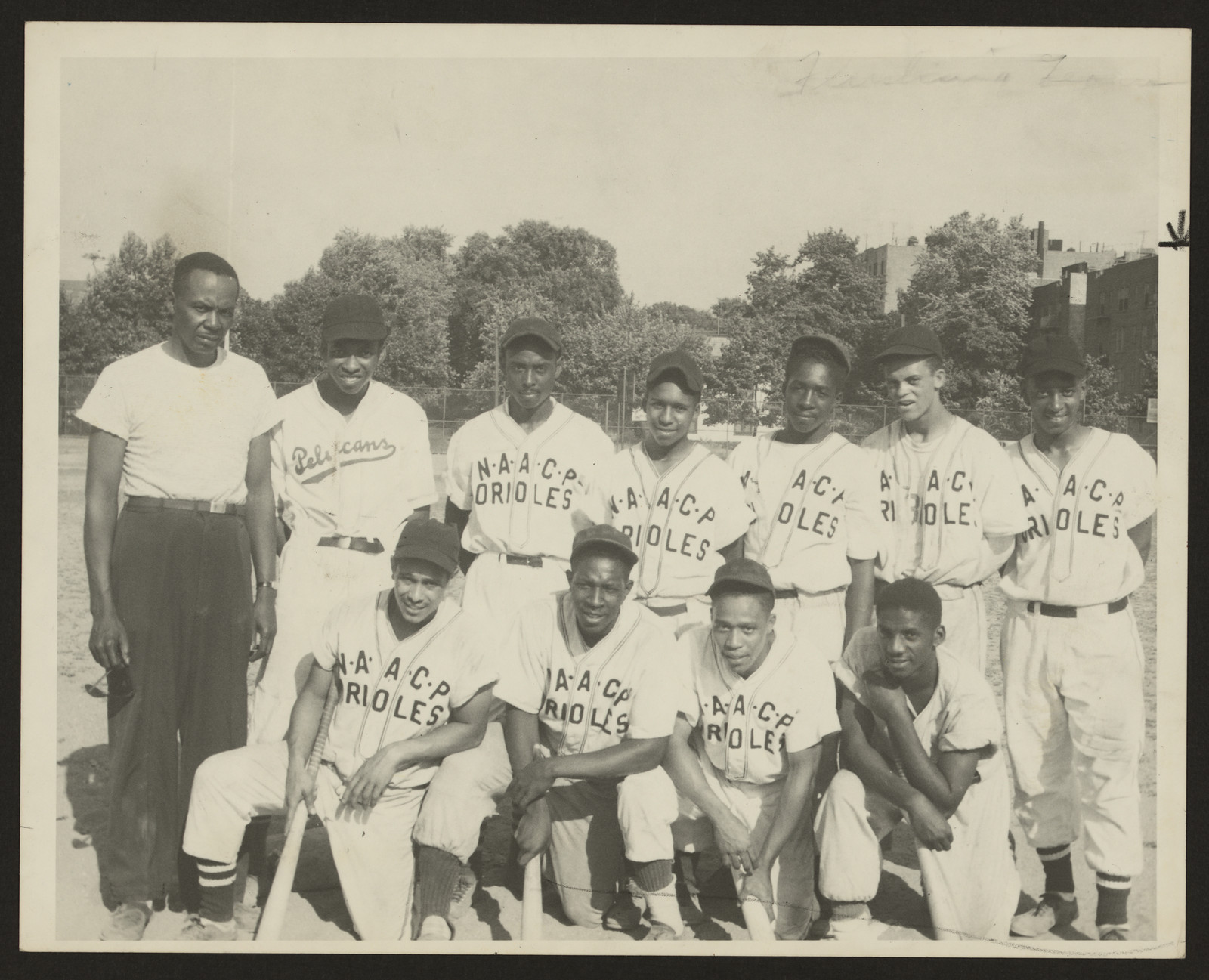 Group portrait of baseball team in NAACP Orioles jerseys — historic image