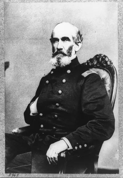 [A.J. Smith, three-quarter length portrait, seated, facing right, right hand in his coat]