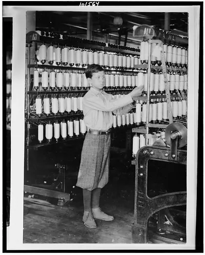 [Back boy - 14 years old - Mule room. Berkshire Cotton Mills.] Location: Adams, Massachusetts. / Lewis W. Hine.