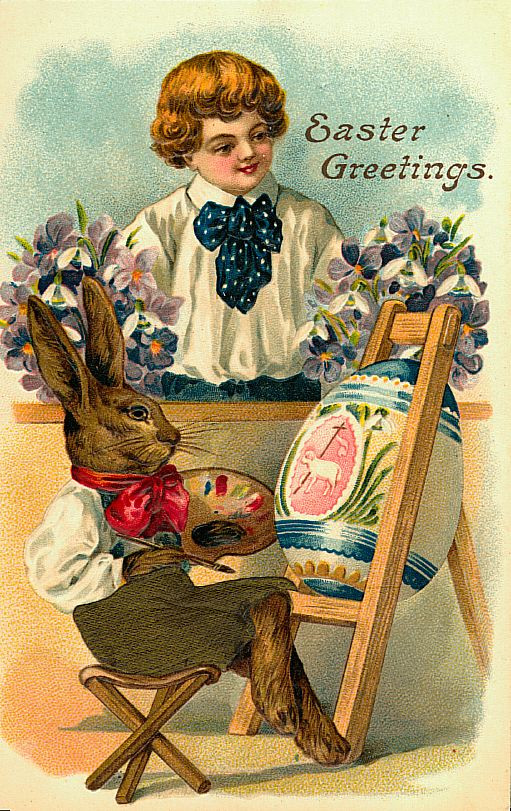 Easter Greetings: rabbit painting an egg beside a boy — historic image