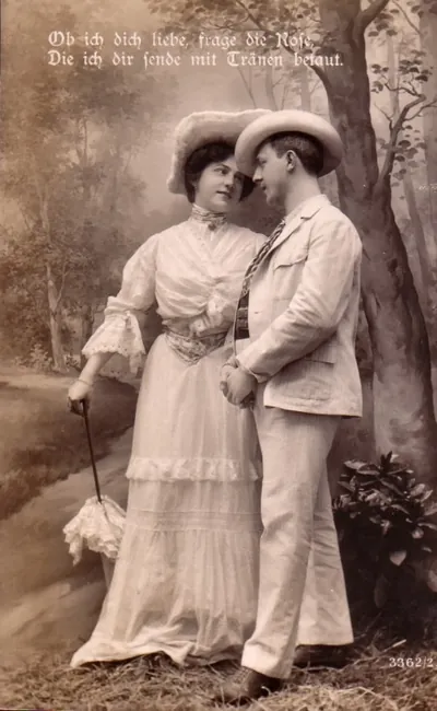 Sepia postcard of a couple with German love verse