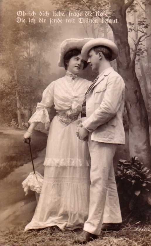Sepia postcard of a couple with German love verse — vintage postcard