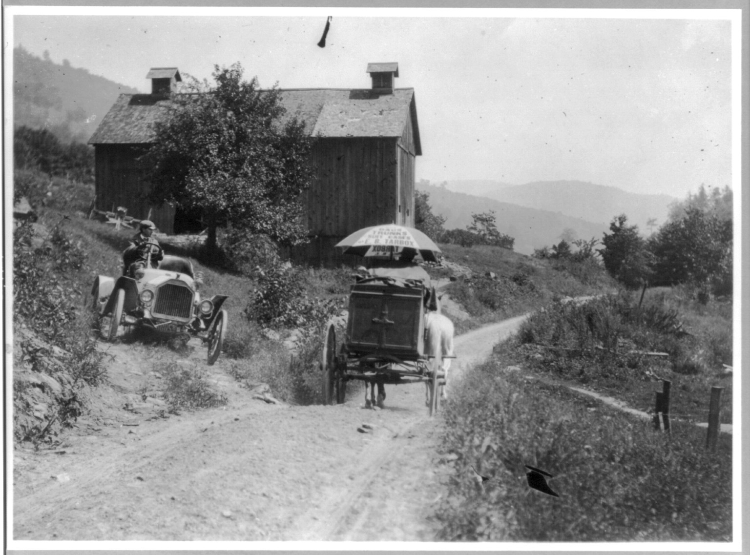 [Buick roadster waits for horse-drawn wagon to pass on narrow country road above Liberty, N.Y.], [1912?] — historic photograph