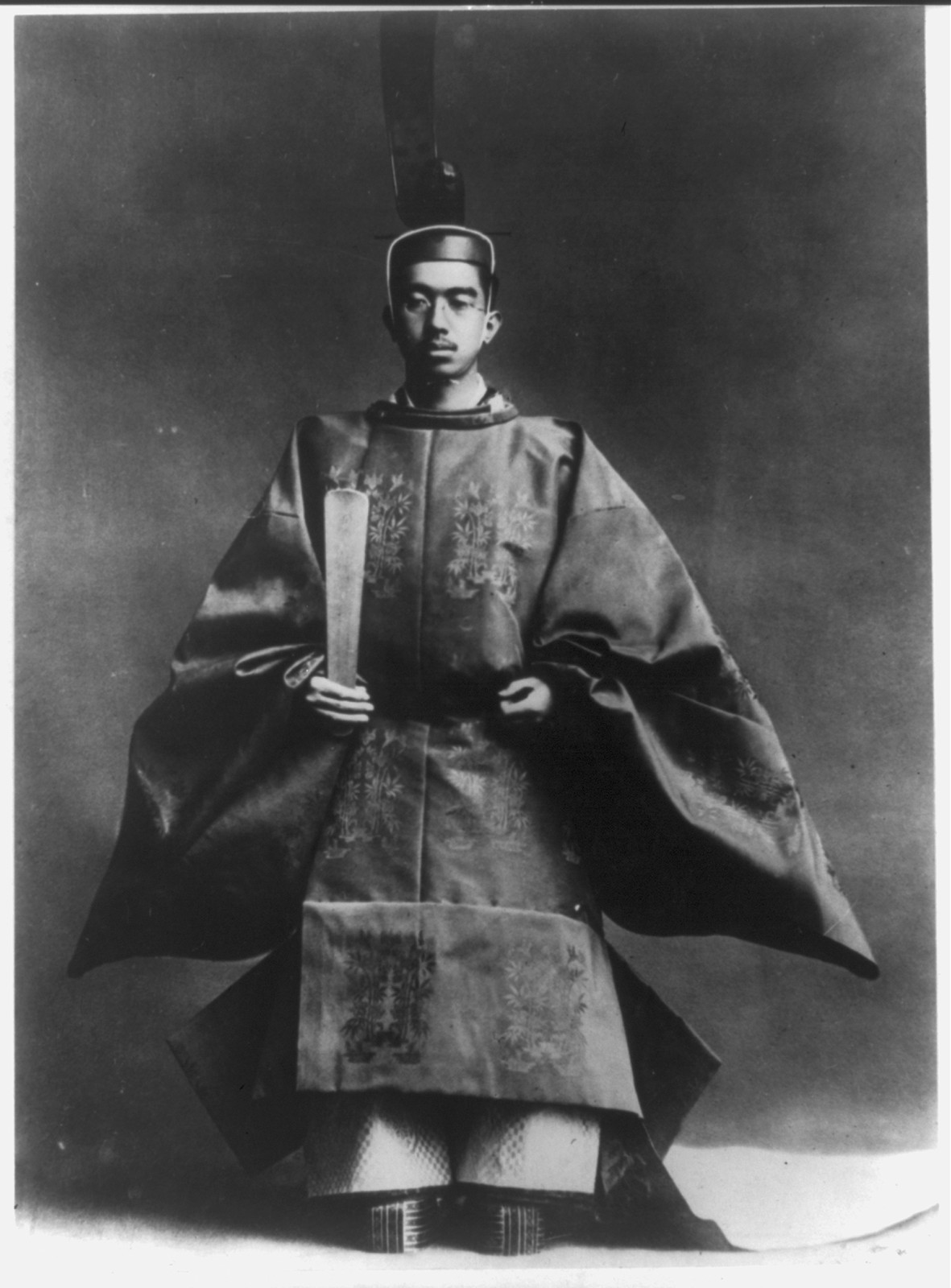 [Hirohito, Emperor of Japan, 1901- , full-length portrait, seated, in coronation regalia] — historic photograph