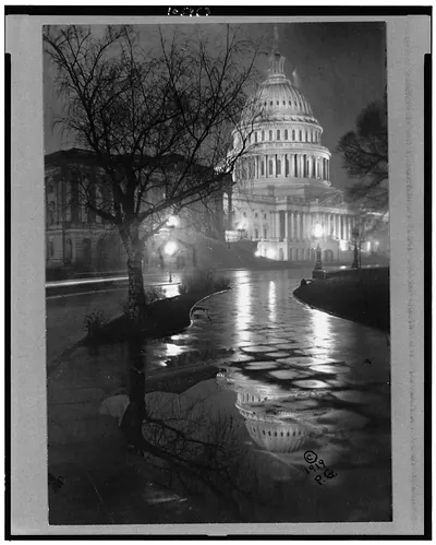 [View of the U.S. Capitol, at night, in rain]