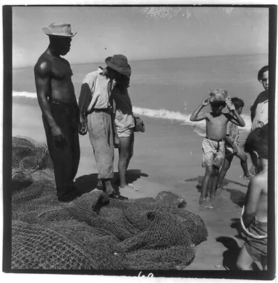 [7 people and large fishing net on beach, Puerto Rico]