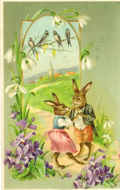 Vintage Easter postcard with dressed rabbits and snowdrops