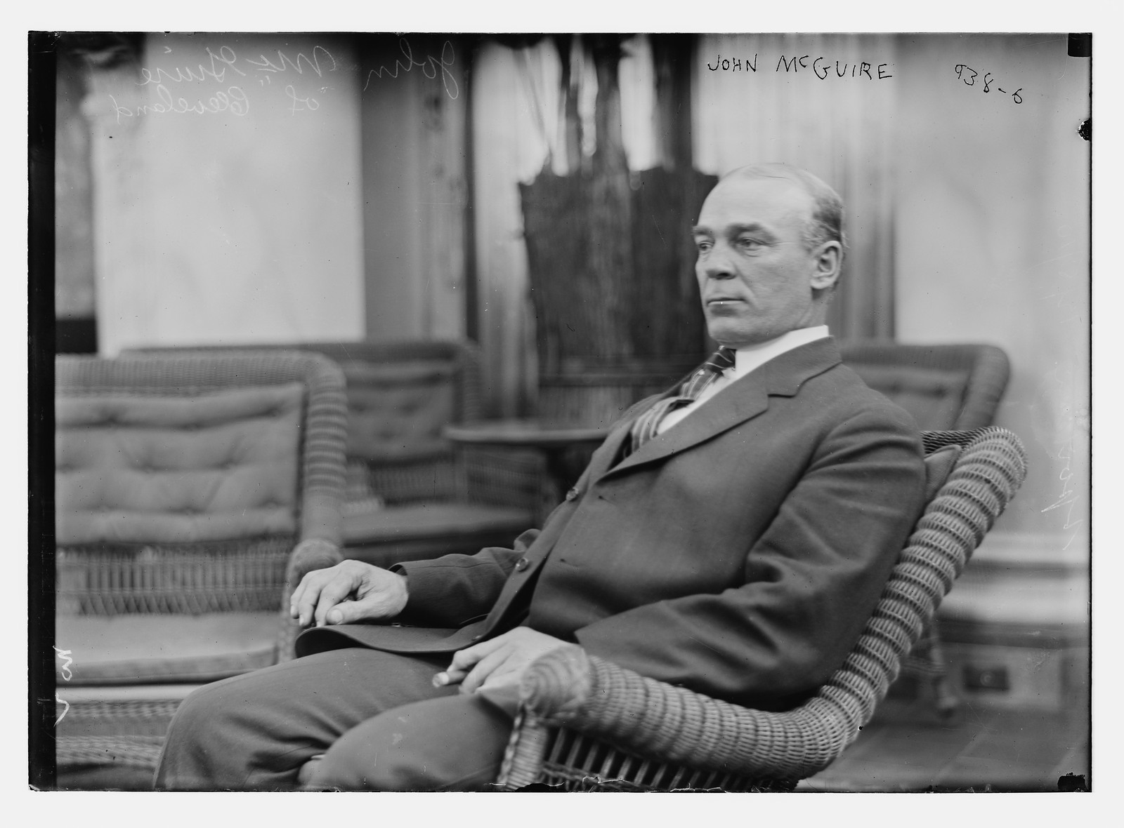 John McGuire of Cleveland seated in rocker, n/a — historic photograph