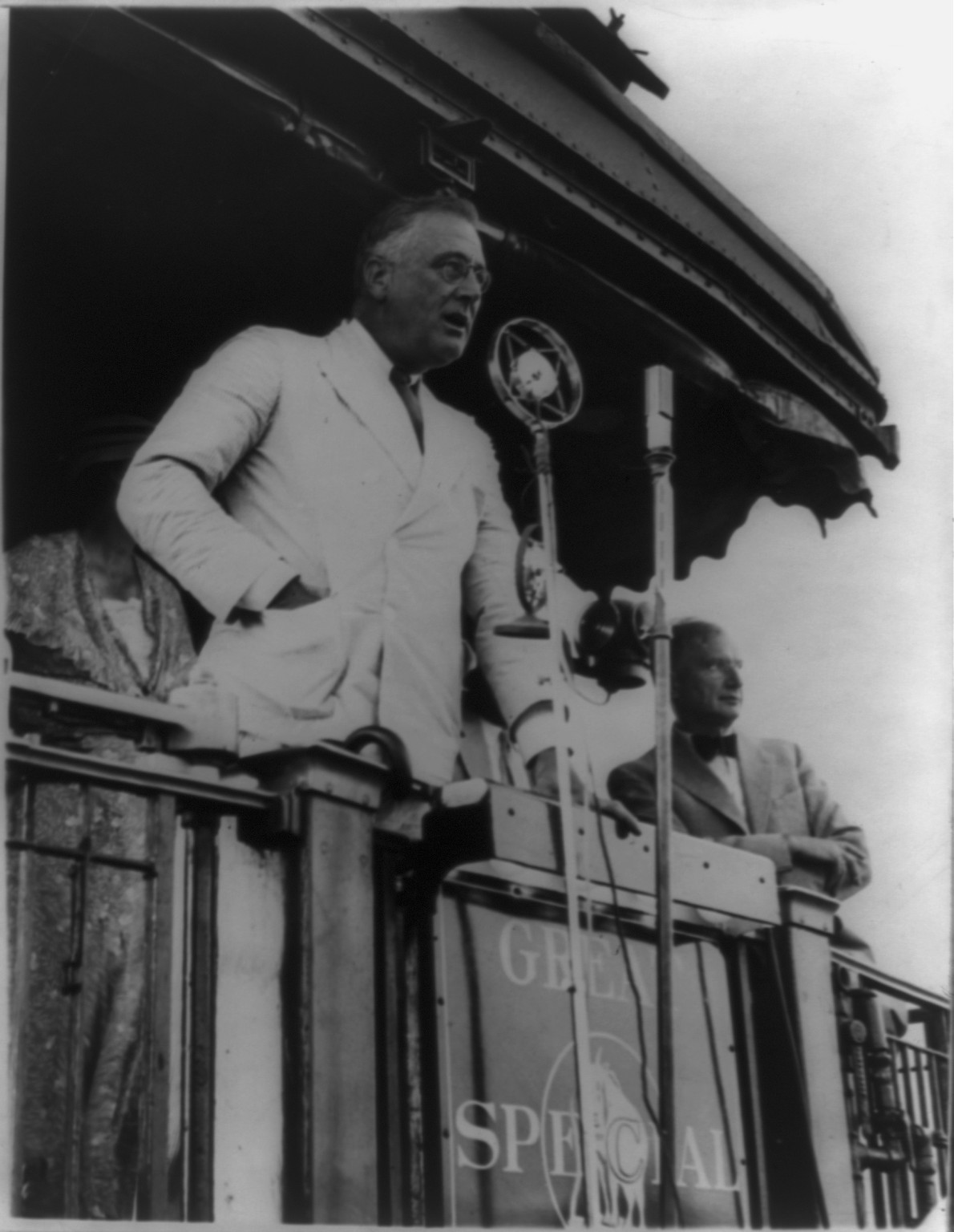 President Franklin D. Roosevelt at Fort Peck, Mont., as he made one of his numerous addresses from the observation platform of his train during his journey over the parched plains of the Northwest, 1934 — historic photograph