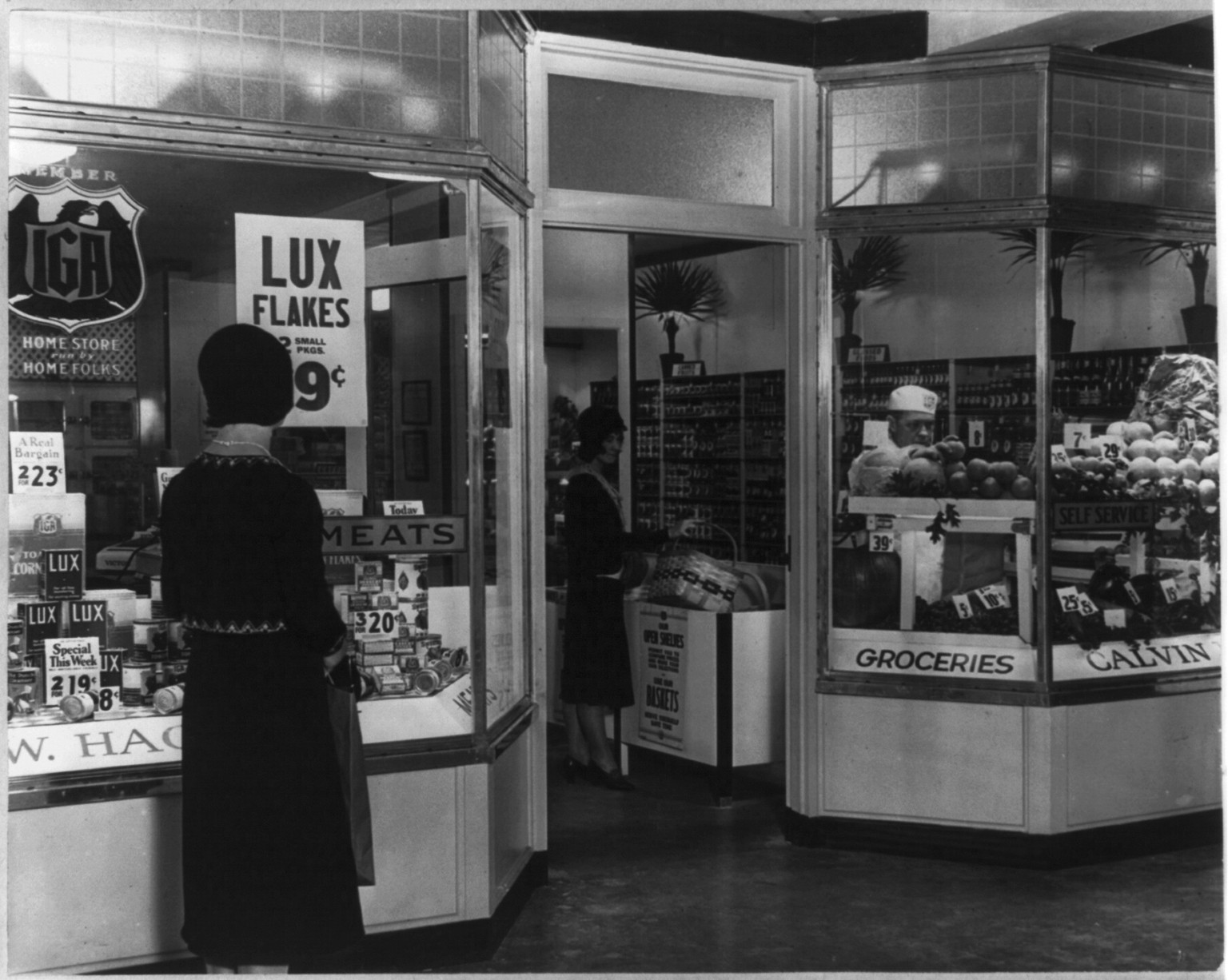 [View from exterior of window displays and interior of IGA grocery store, Chicago, Ill.], 1930 Oct. 8. — historic photograph