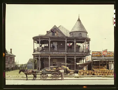 Victorian house with fruit stand and horse-drawn cart