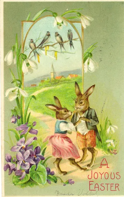 Vintage Easter postcard with dressed rabbits and birds