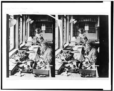 [Three men in workshop making tobacco pipes]
