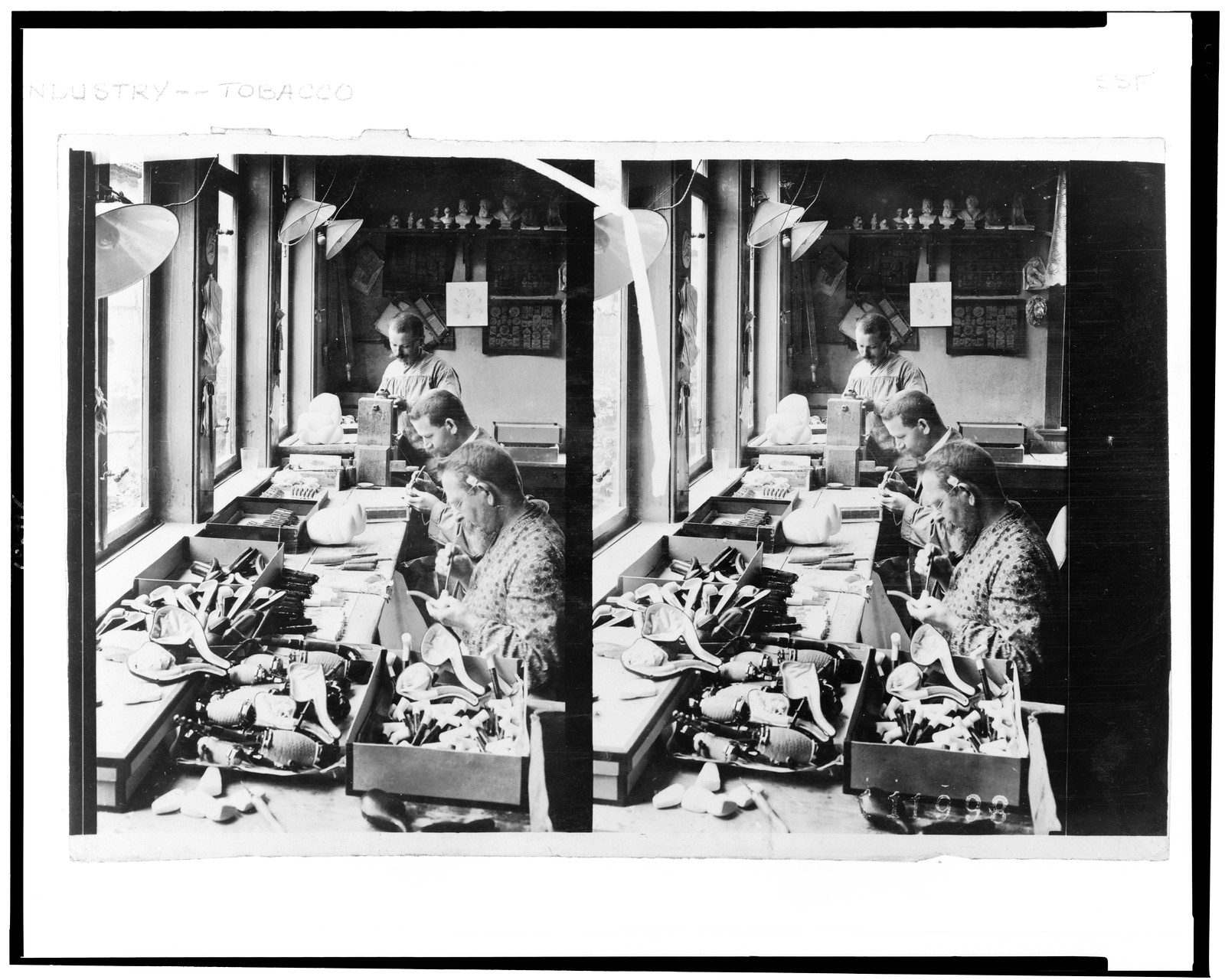 [Three men in workshop making tobacco pipes], c1908 July 12. — historic photograph