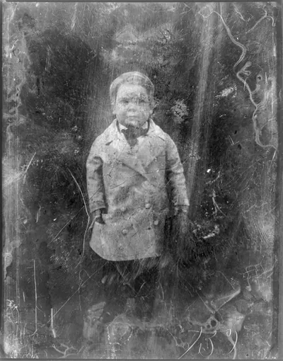 [Tom Thumb, full-length portrait, facing front, standing on table with tablecloth]