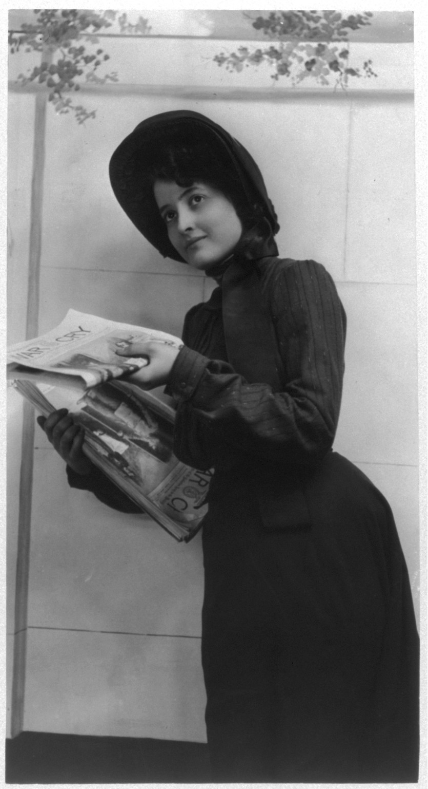 [Young woman modeling: distributing copies of Salvation Army newspaper, War Cry], [no date recorded on caption card] — historic photograph