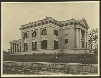 Neoclassical library building with columns and arched windows
