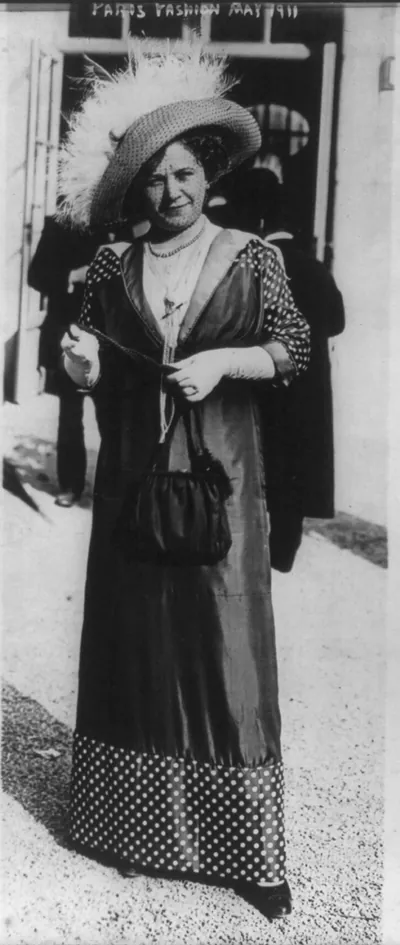 [Women's fashions: Paris fashion, May 1911: polka-dot sleeves and hem]