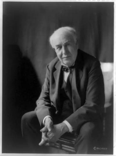 [Thomas Alva Edison, three-quarter length portrait, seated, facing left, hands folded]