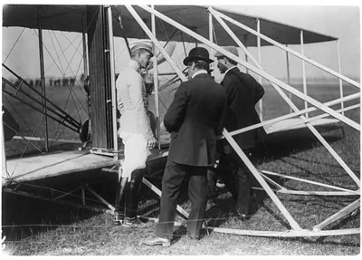 Crown Prince of Germany, Hart O. Berg, and Orville Wright [standing by airplane], Berlin, 1909