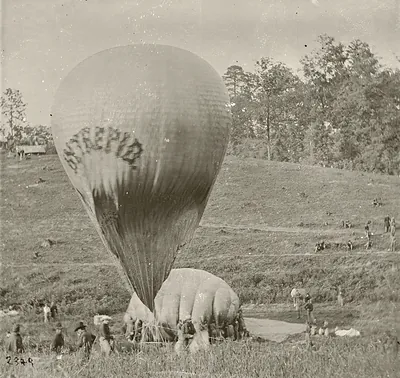 Civil War observation balloon being inflated in a grassy field