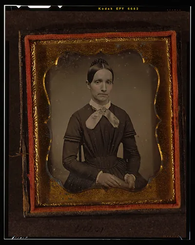 Seated woman in ornate daguerreotype case