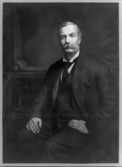 [Gov. Fred Maltby Warner, three-quarter length portrait, seated, facing left]