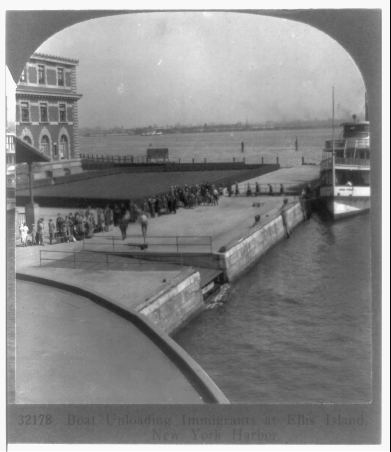 Boat unloading immigrants at Ellis Island, New York harbor, Meadville, Pa. [ and 4 other cities] : Keystone View Company, c1928. — historic photograph