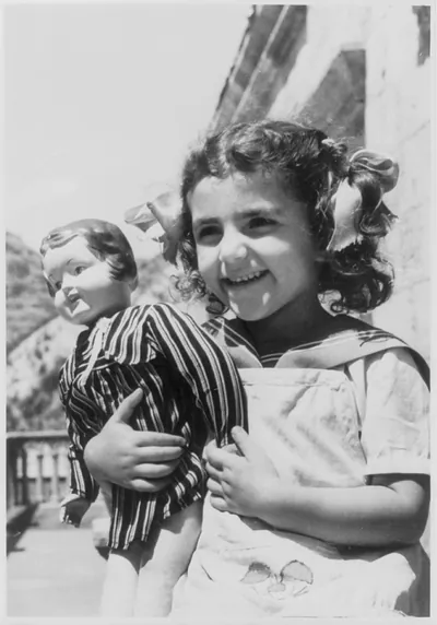 [Armenian S.S.R.: Smiling girl holding doll]