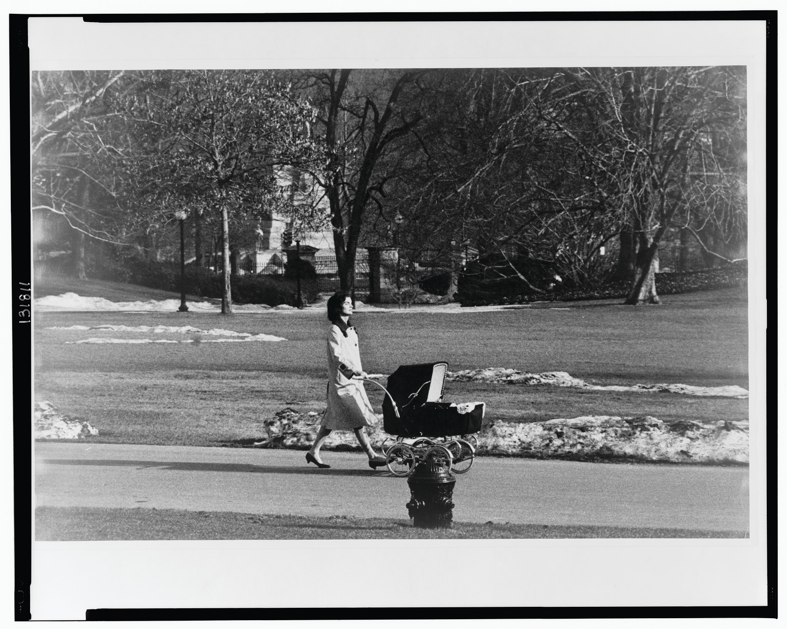Fresh air on the White House grounds for John F. Kennedy, Jr., in March 1961 / Capa. — historic photograph