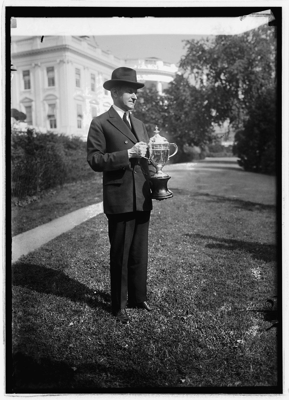 Coolidge with Coolidge Cup he will present to enlisted men, 10/18/24, [19]24 October 18. — historic photograph