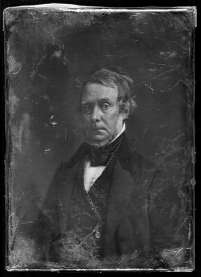 Daguerreotype portrait of a man in dark coat