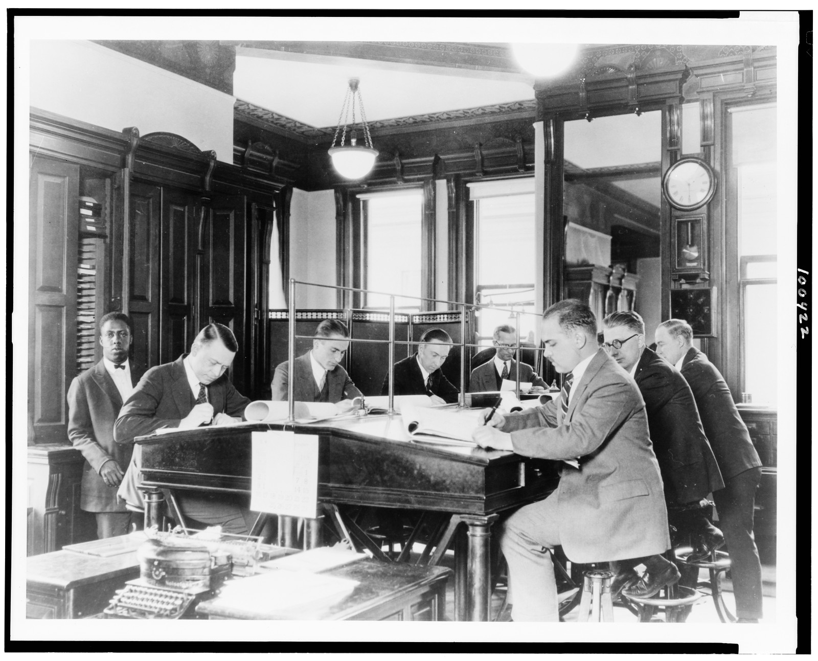 [Men working in Weather Bureau office, 24th & M Street, N.W. Washington, D.C.], [1926, printed 198-] — historic photograph