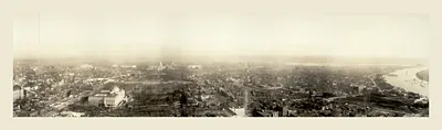 Panoramic aerial view of a city with river and domed building