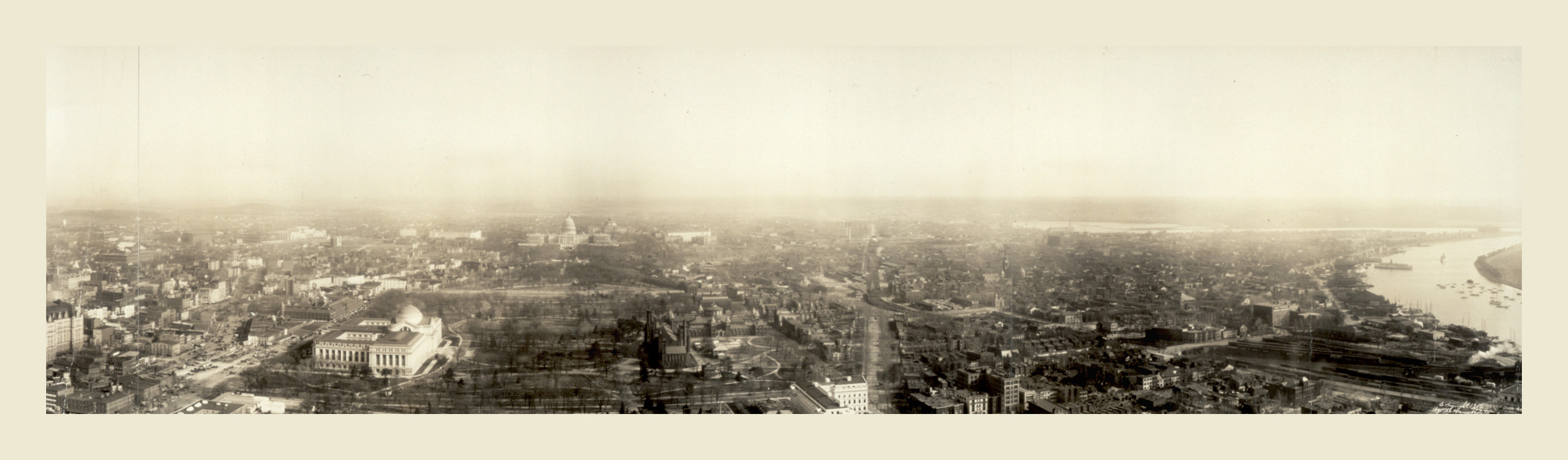 Panoramic aerial view of a city with river and domed building — historic image