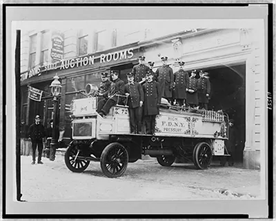 [Firemen posed on fire engine, New York City]