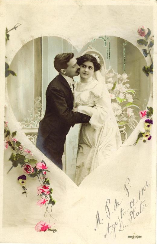 Hand-colored postcard of a wedding couple in a heart frame — vintage postcard