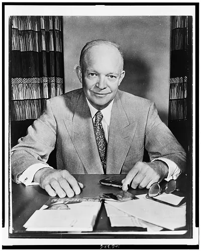 [Dwight D. Eisenhower, half-length portrait, seated at desk, facing front]