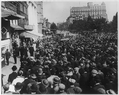 Baseball crowd watching Washington Post World Series scoreboard