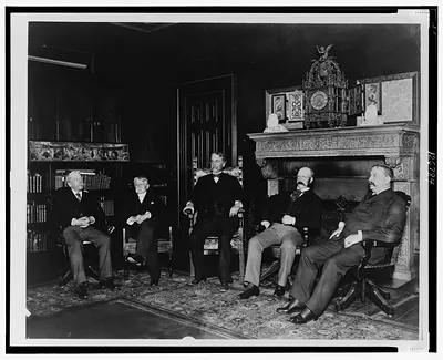 [Trustees of the Boston Public Library, seated left to right: Henry W. Haynes, Frederick O. Prince, Samuel A.B. Abbot, William R. Richards, and Phineas Pierce, in room with clock on mantel] / Halberstadt Photographs, Boston [and] Cambridge, Mass.