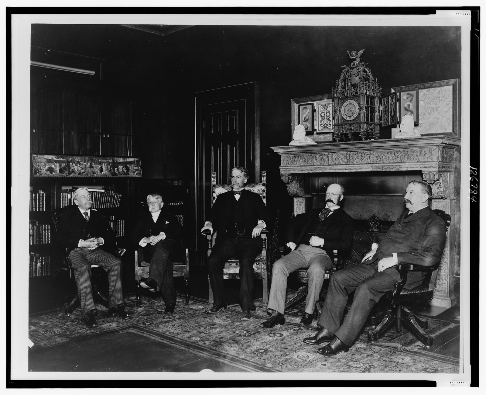 [Trustees of the Boston Public Library, seated left to right: Henry W. Haynes, Frederick O. Prince, Samuel A.B. Abbot, William R. Richards, and Phineas Pierce, in room with clock on mantel] / Halberstadt Photographs, Boston [and] Cambridge, Mass., [1893 or 1894] — historic photograph
