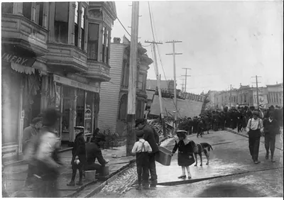 Earthquake and fire, San Francisco, Calif.: Collapsed Valencia St. Hotel; people dipping water from street from broken water main; most of shock was here - ground settled 12 feet