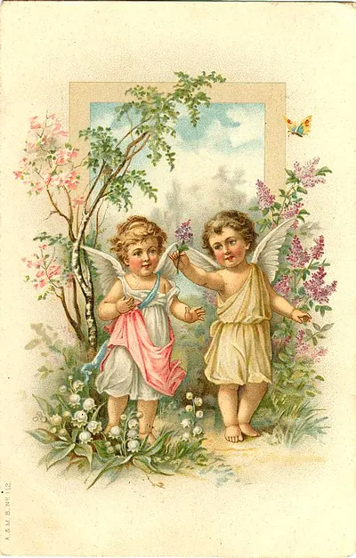 Two winged cherub angels among spring flowers and lilacs