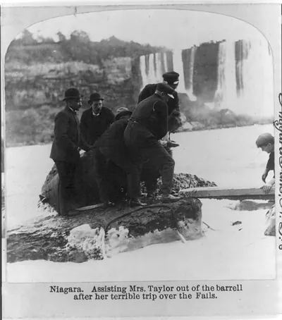 Niagara. Assisting Mrs. [Anna E.] Taylor out of the barrell [sic] after her terrible trip over the falls