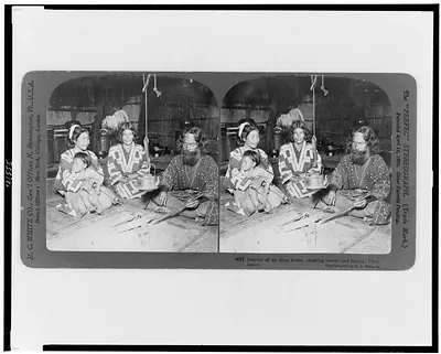 Interior of an Ainu home, showing owner and family, Yezo, Japan