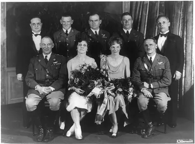 [Carl Spaatz and Amelia Earhart posed with seven other people]