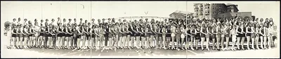 Panoramic photograph of women in bathing suits on a beach